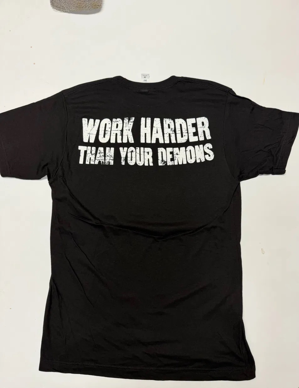 "Work Harder Than Your Demons" Tee — White Ink (front)